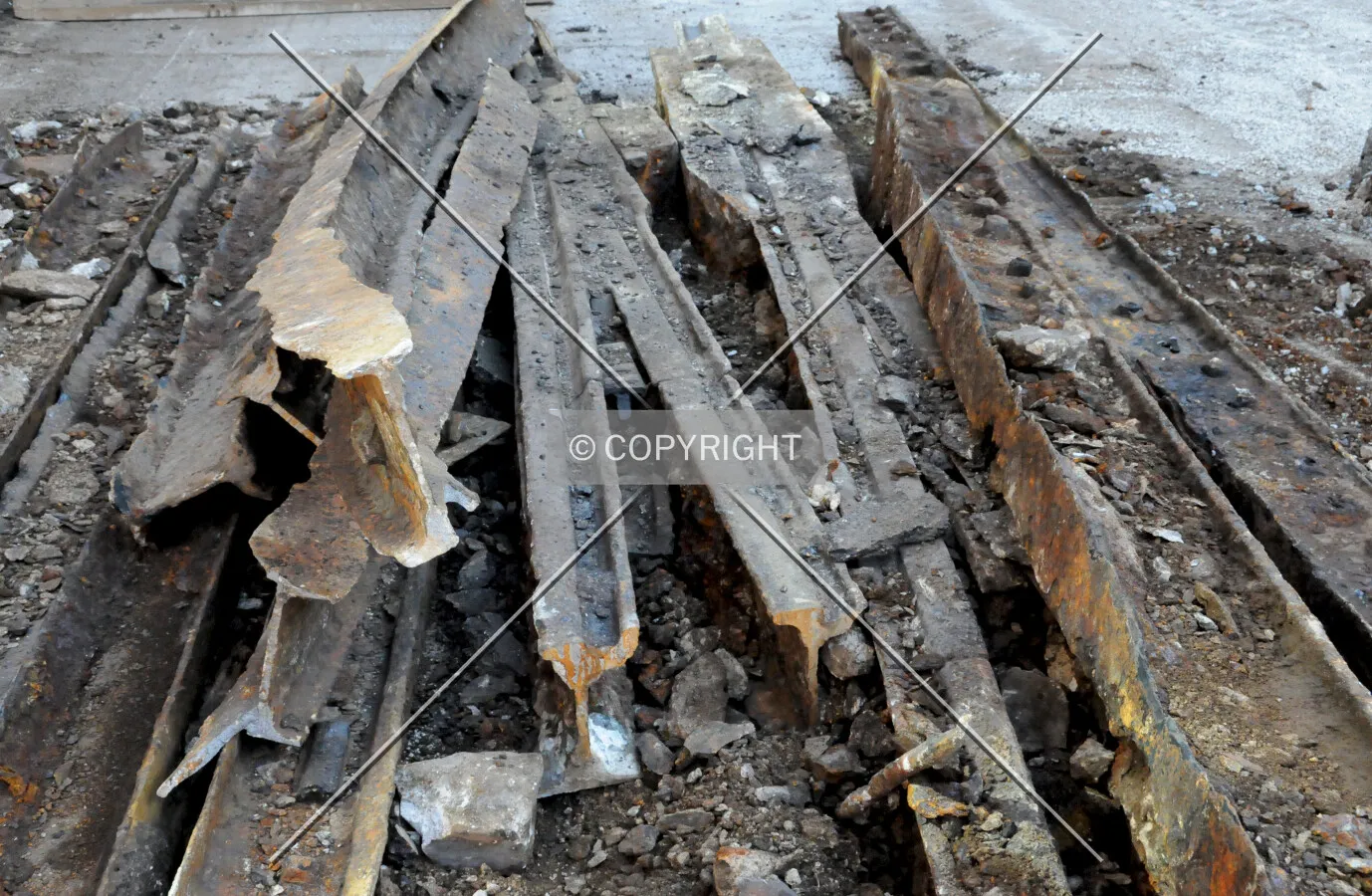 Rails removed from a former street railway in Erie Street during the installation of new water pipes