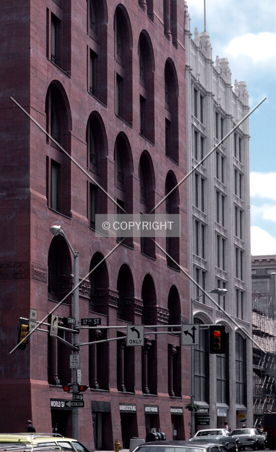 Vintage view from the northeast along Champa Street with the Boston Building to the left