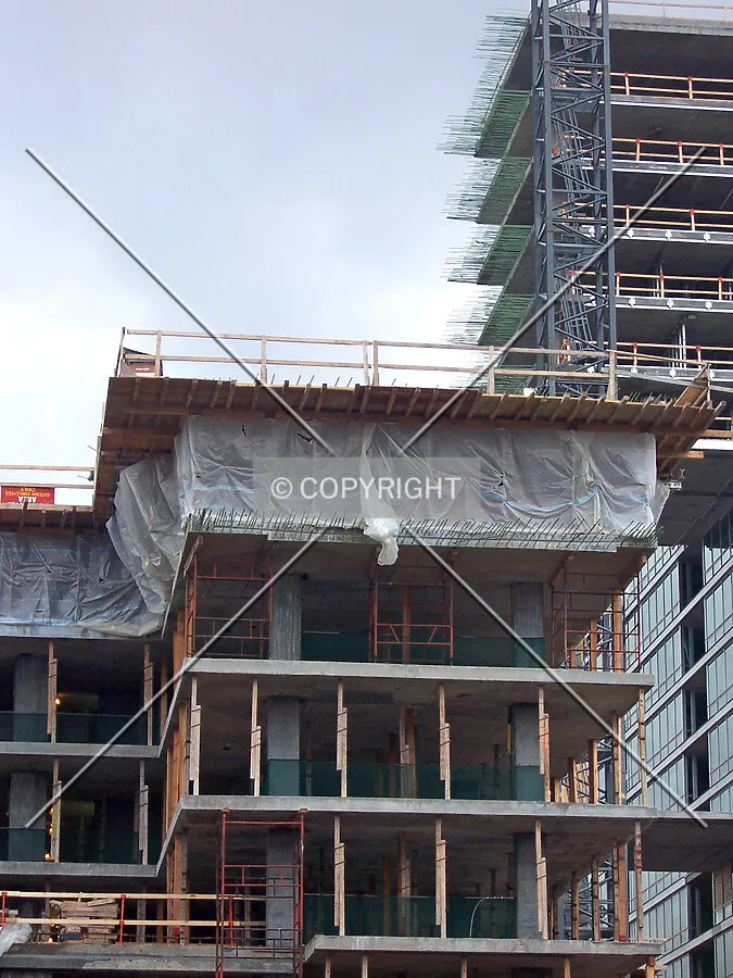 Elm Tower with the Oak Tower rising above in the background; the two towers will join and bridge a gap by linking the floor slabs with the protruding rebar visible in the upper right corner