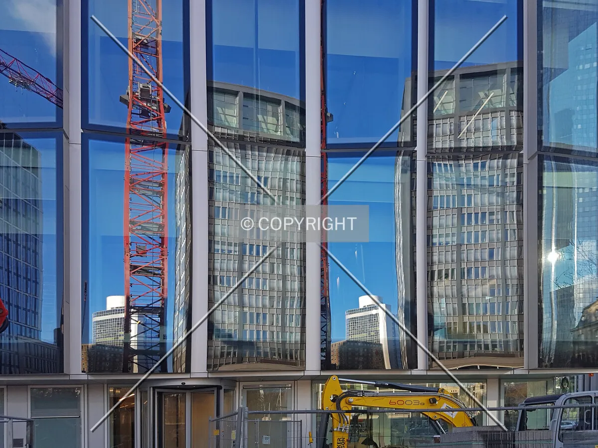 T11 office tower reflecting in the facade