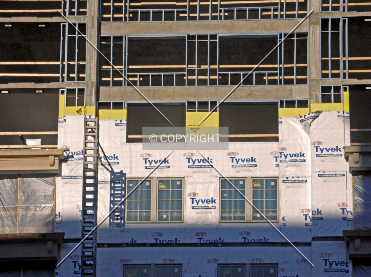 Layers of facade construction along Davis Street
