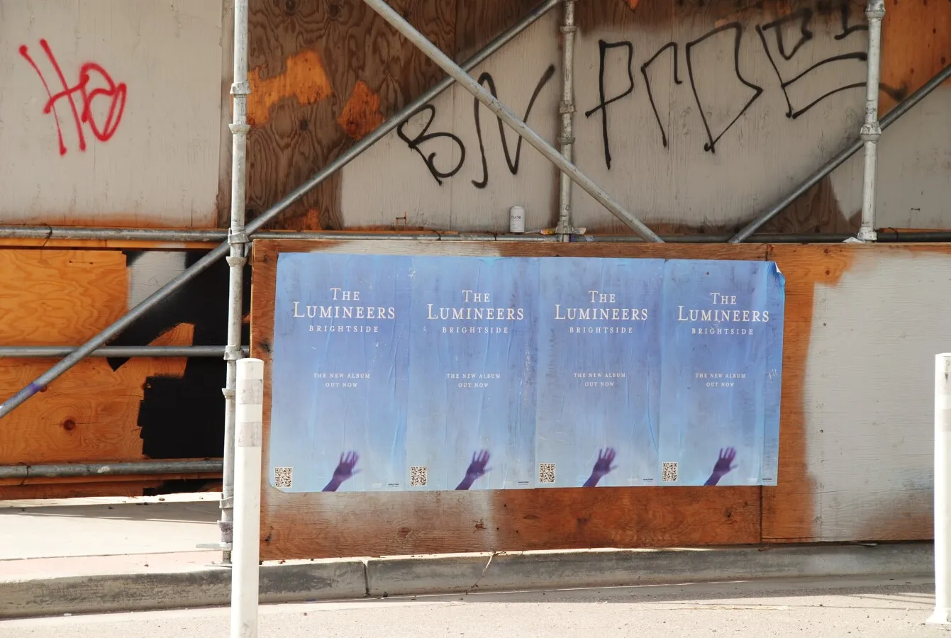 Music posters on the sidewalk barrier