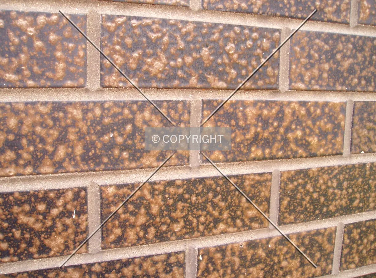 Brick facade on the ground floor, which is darker than the 12 upper floors