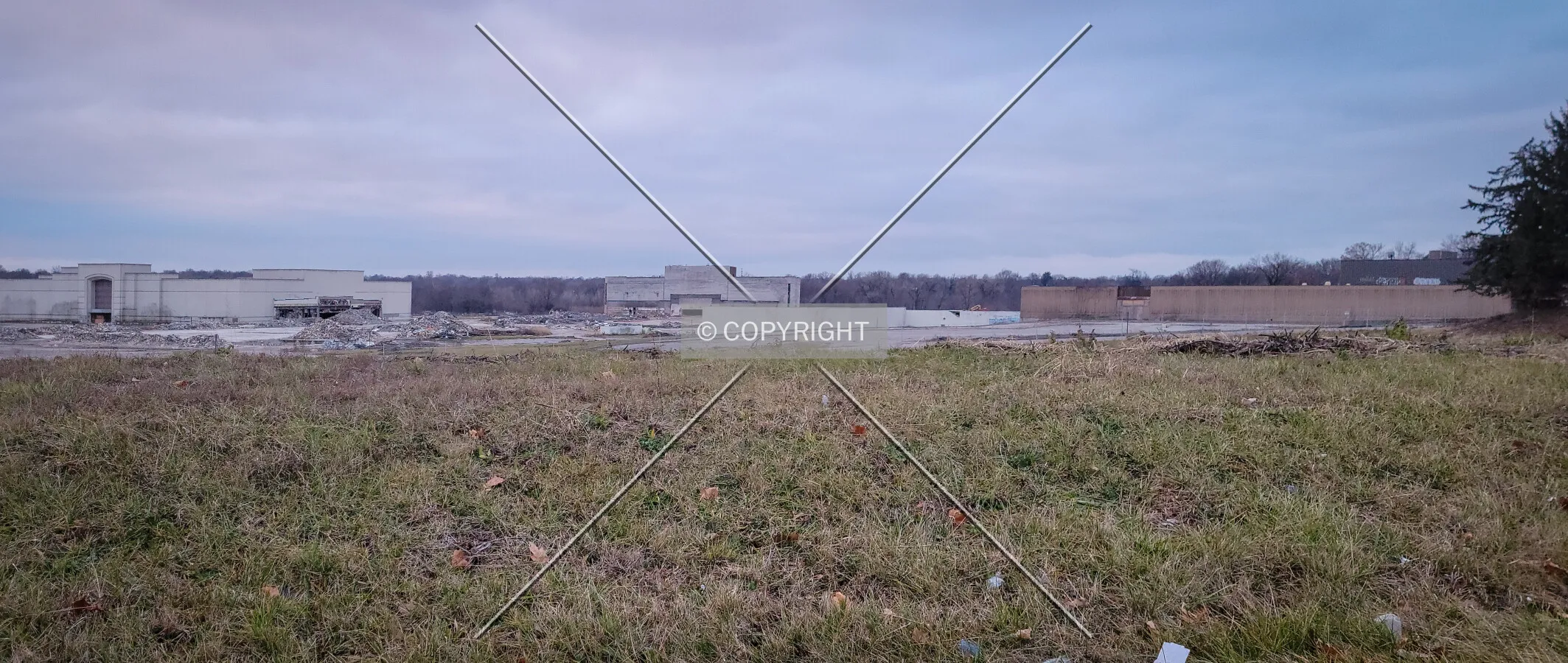 From the northeast during demolition. Only Macy's, Dillard's, and Sears are still remaining; December 31, 2023