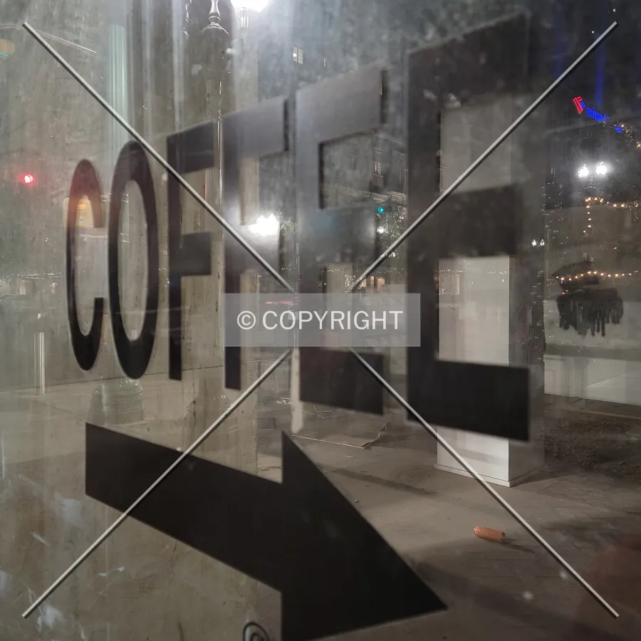 Coffee sign in a first floor window; November 15, 2021