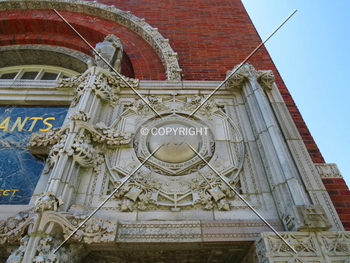 Cartouche with date of building construction to the right of main entrance