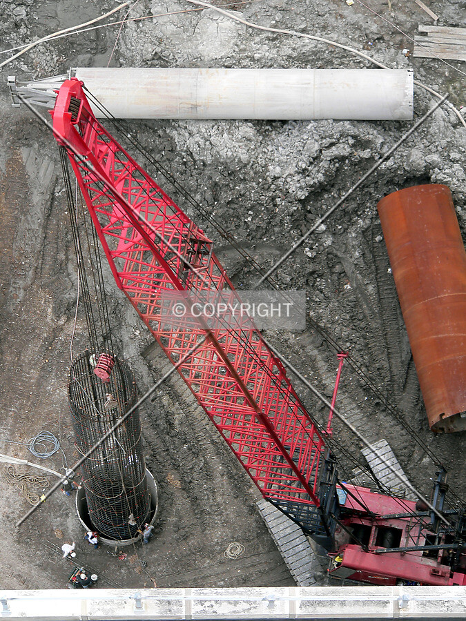 View from the 35th floor of the LaSalle-Wacker Building, showing a rebar cage being lowered into a caisson hole