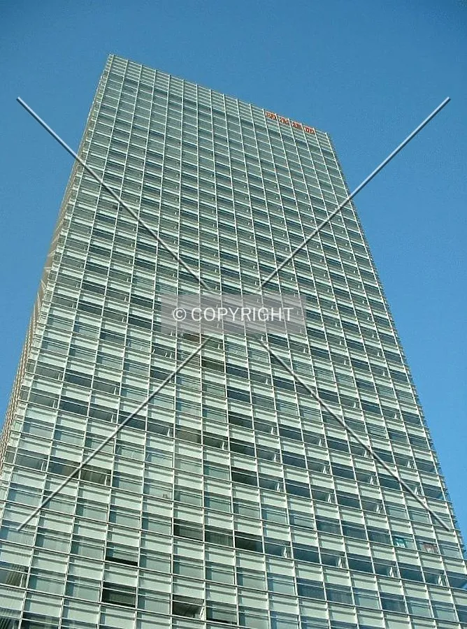 Blue sky, green building