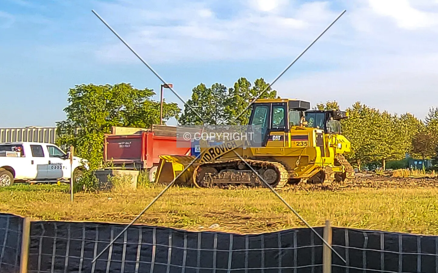 Construction equipment ready for site work; July 2, 2021
