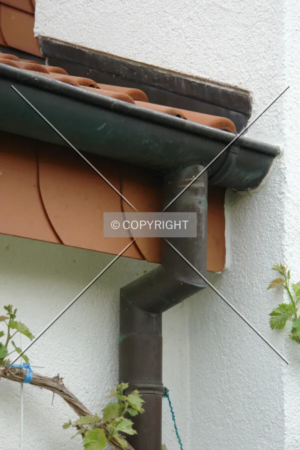 A bronze roof gutter