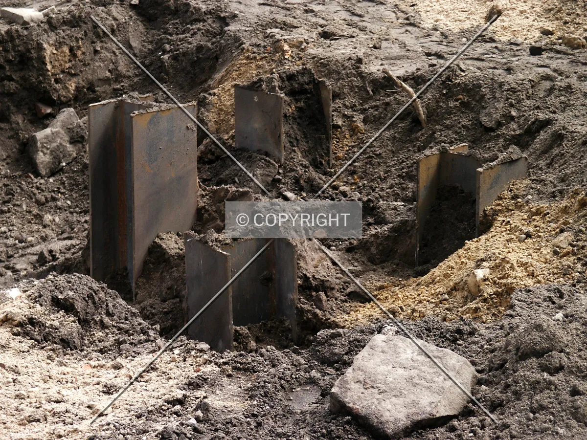 Tops of piles emerging from the earth
