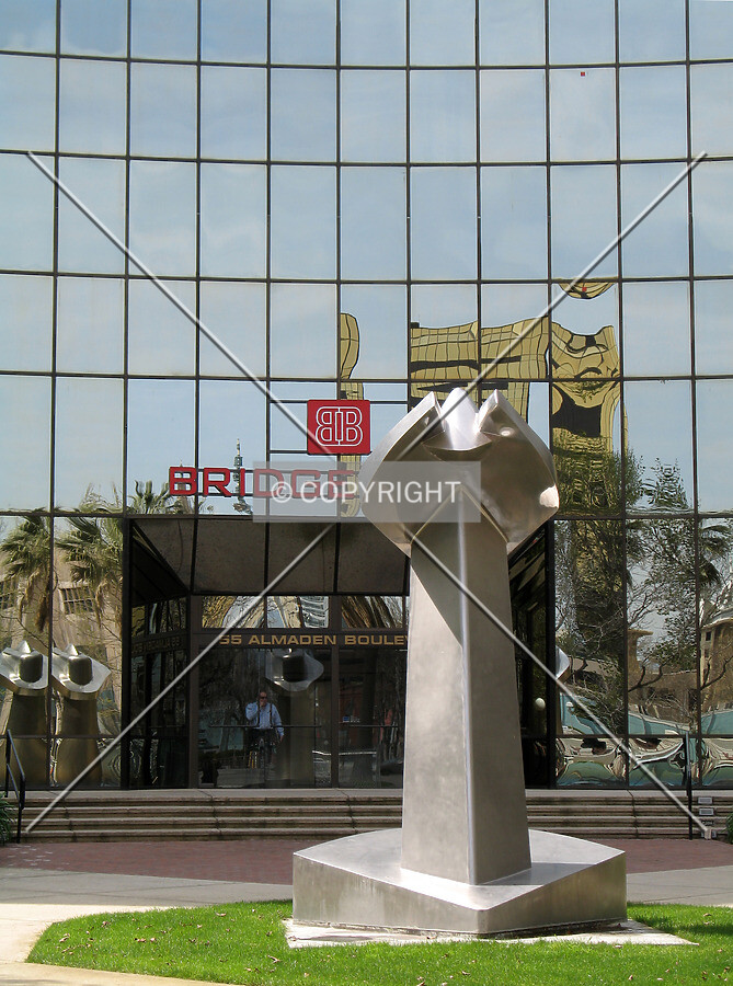 An aluminum sculpture is planted in front of the main entrance
