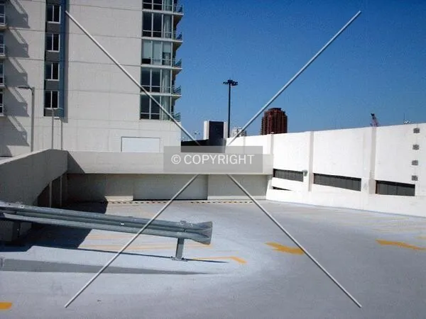 Garage door between covered parking and open spaces on the roof