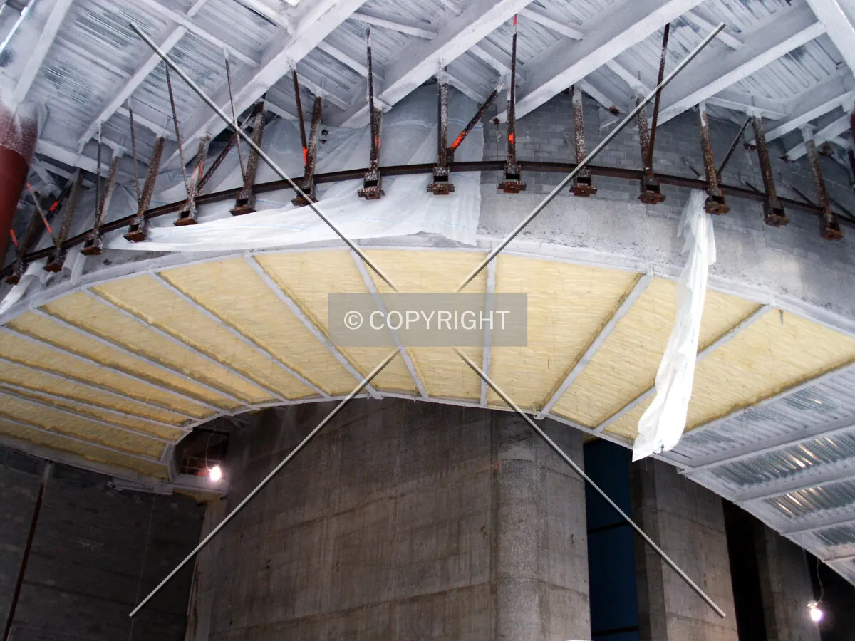 Underside of the car ramp disappearing into the lobby ceiling