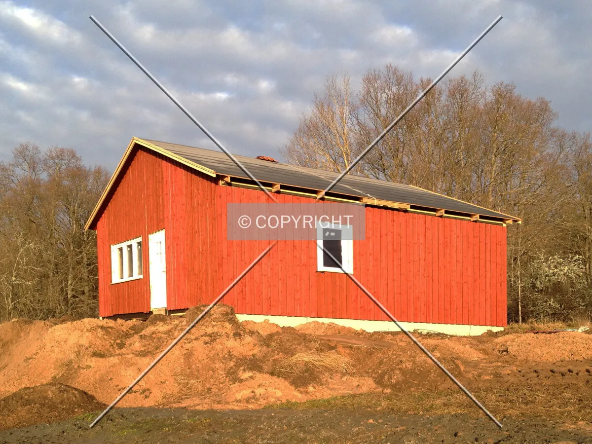 A wooden house under construction