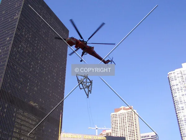 Lifting the second piece of framework past the IBM Building