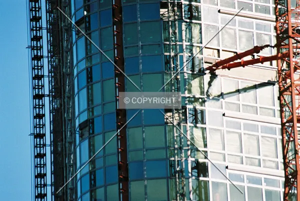 View of the facade including cranes