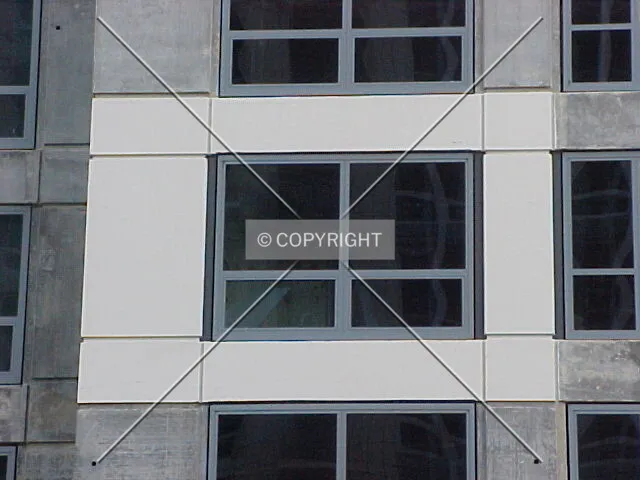 Partially painted facade and window detail