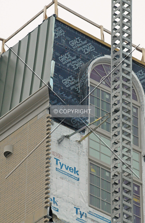 Top of the southeast corner showing clad and unclad areas of the exterior facade