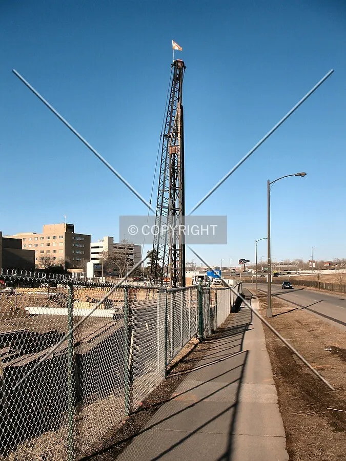 Pile driver at rest, view to the northeast along East 12th Street