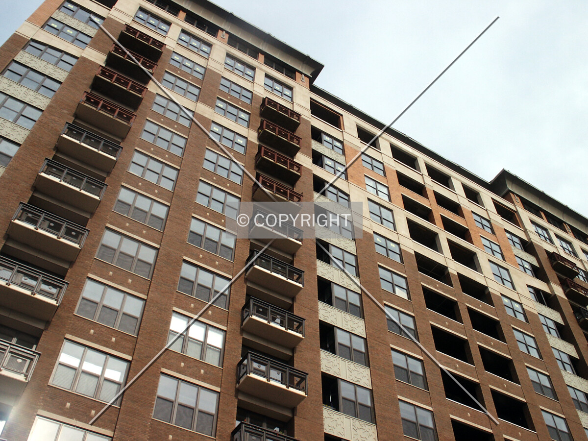 Looking up the west facade, with upper balconies waiting to be painted