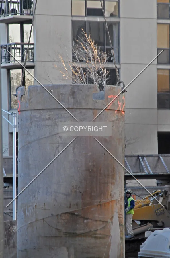 Cassion top being placed into the ground for earth retention on the eastern edge of the site