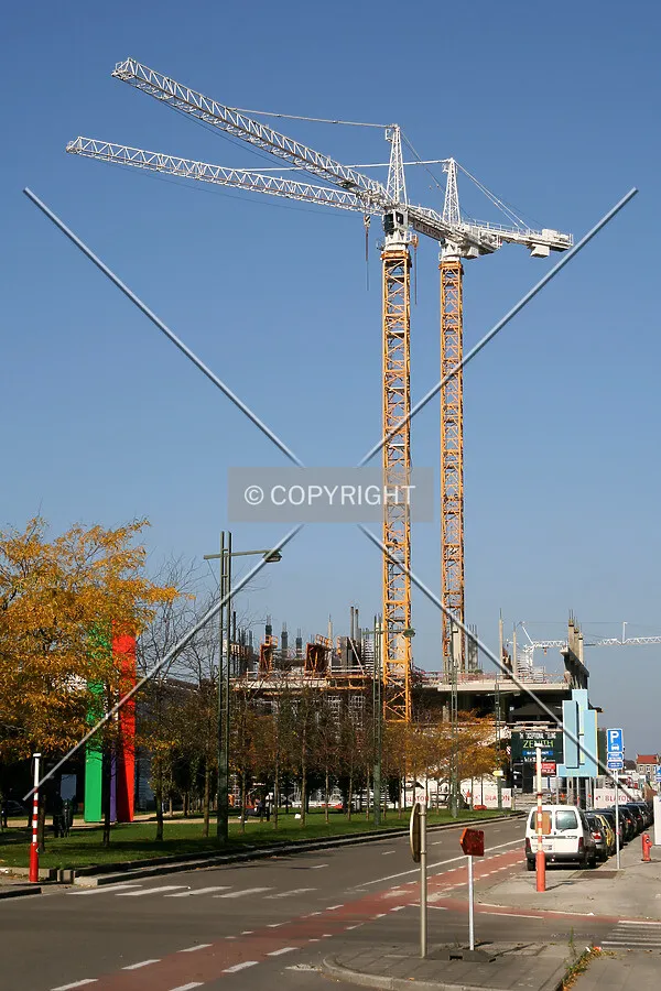 Tower cranes seen from Boulevard du Roi Albert II