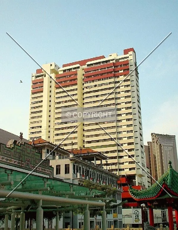 View of tower after a fresh paint job from Eu Tong Sen Street