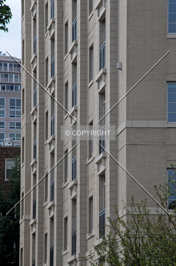 Facade texture created by window bays along Davis Street