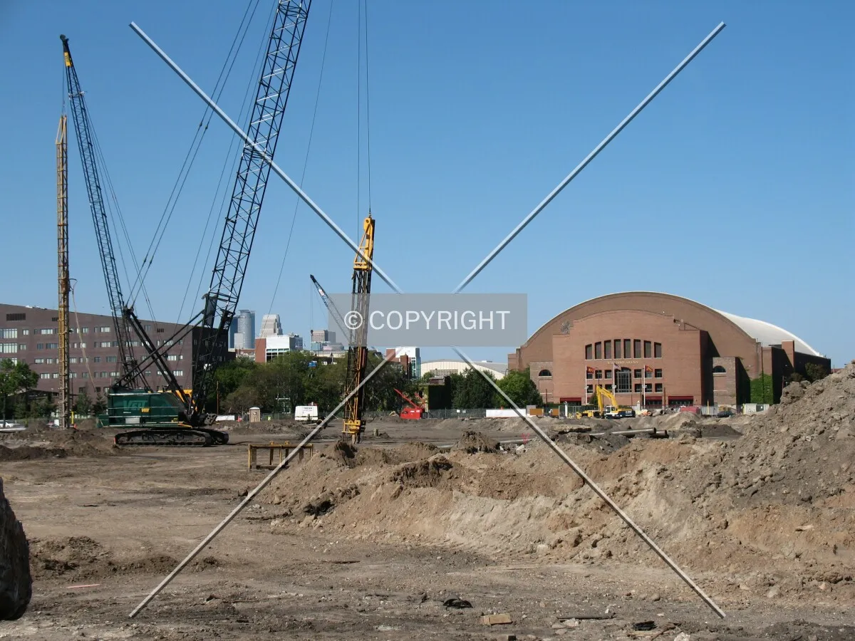 Piledrivers at rest, Williams Arena in the distance