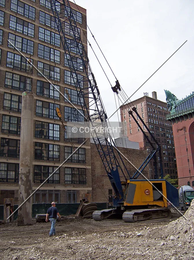 A service crane prepairing to lift a caisson top