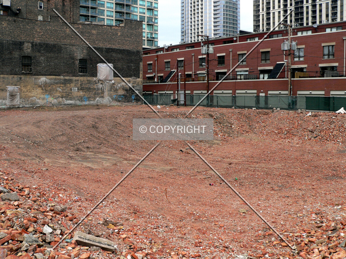View to the northeast with bricks and debris left over from demolition