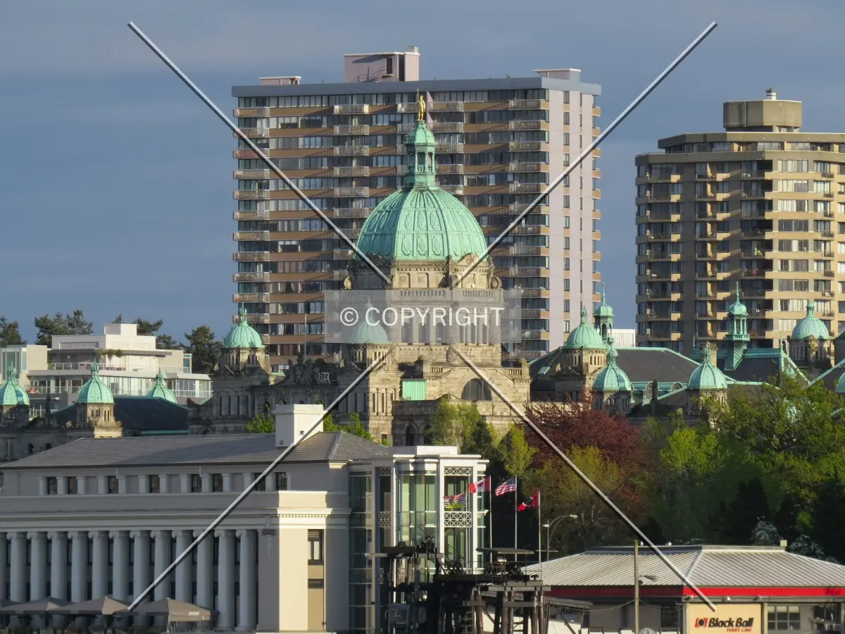 Distant view to the southeast across Victoria's Inner Harbour and the British Columbia Parliament Building from Songhees Point Park