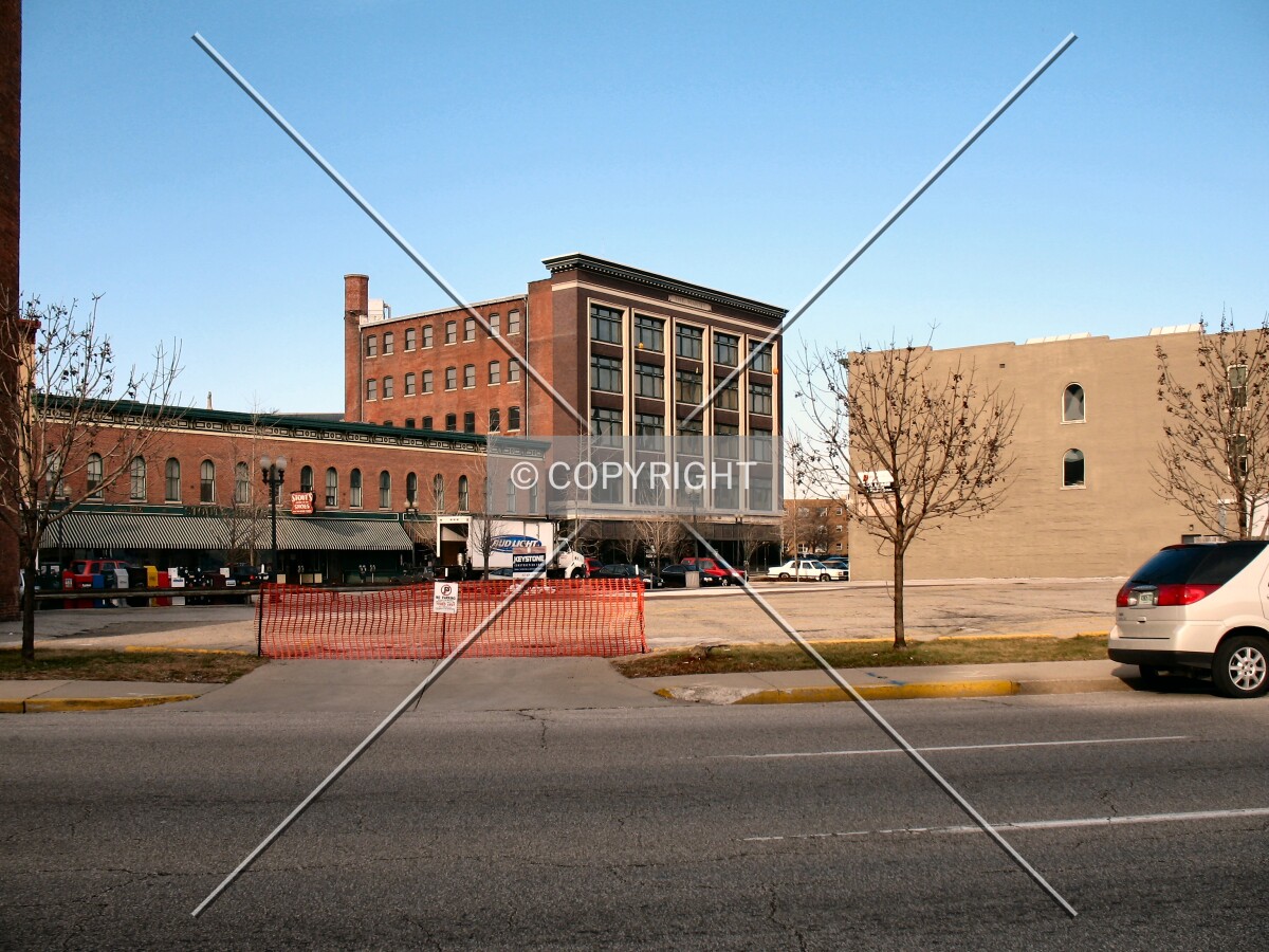 View to the north from East New York Street, across the cleared site for Three Mass Ave