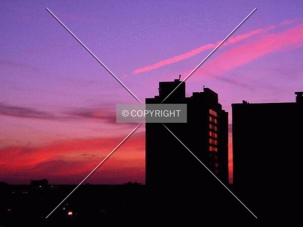 Silhouetted against a vibrant sunset, from the east