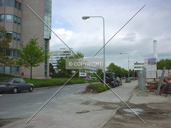 Site entrance; Atricom office building on the opposite street side (left)