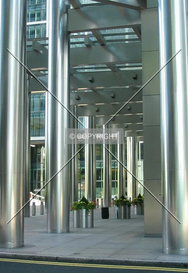 The stainless steel columns bounce light around the entrance