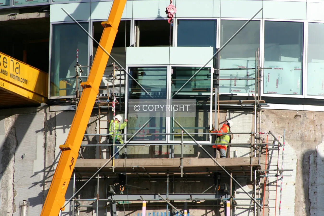 View from Smallbrook Queensway of a crane lifting a facade panel