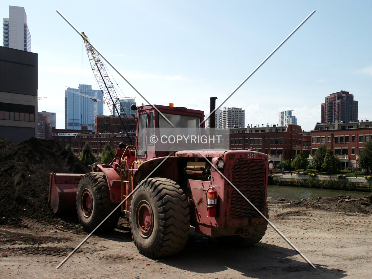 Tractor preparing the site for construction