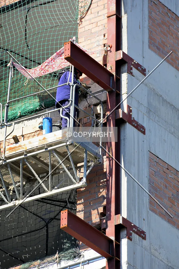 Worker doing some work on the steel structure