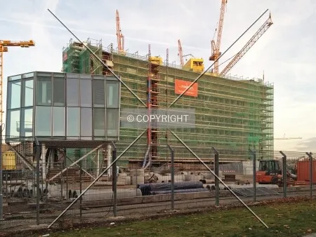 Scaffolding and cranes around the building