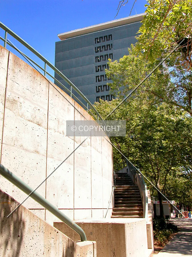 Building behind stairs to an elevated plaza