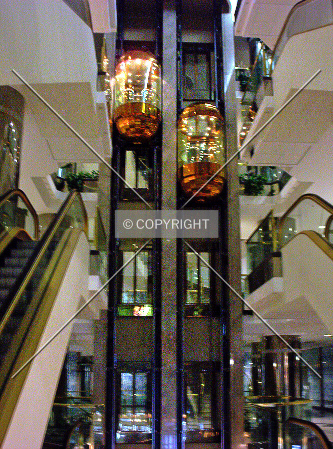 The golden elevators inside the atrium