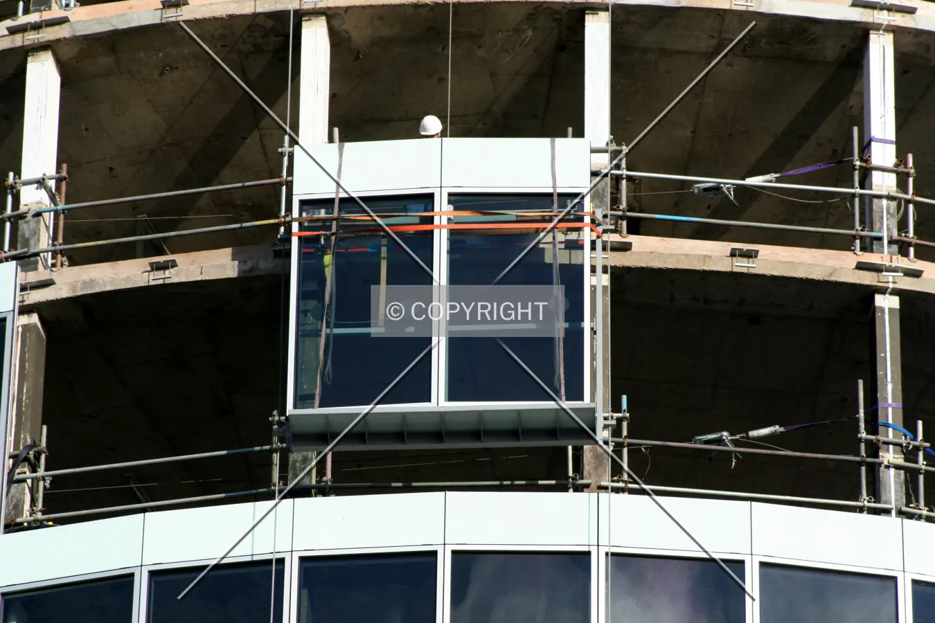 Looking up at facade installation from Smallbrook Queensway
