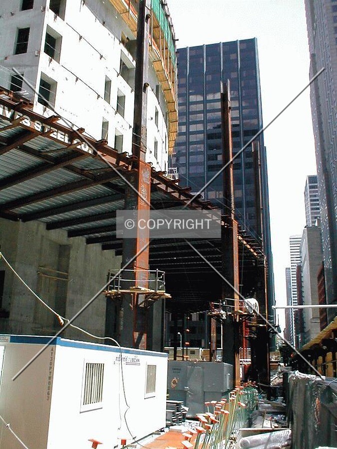 Steel beams rising along Monroe Street