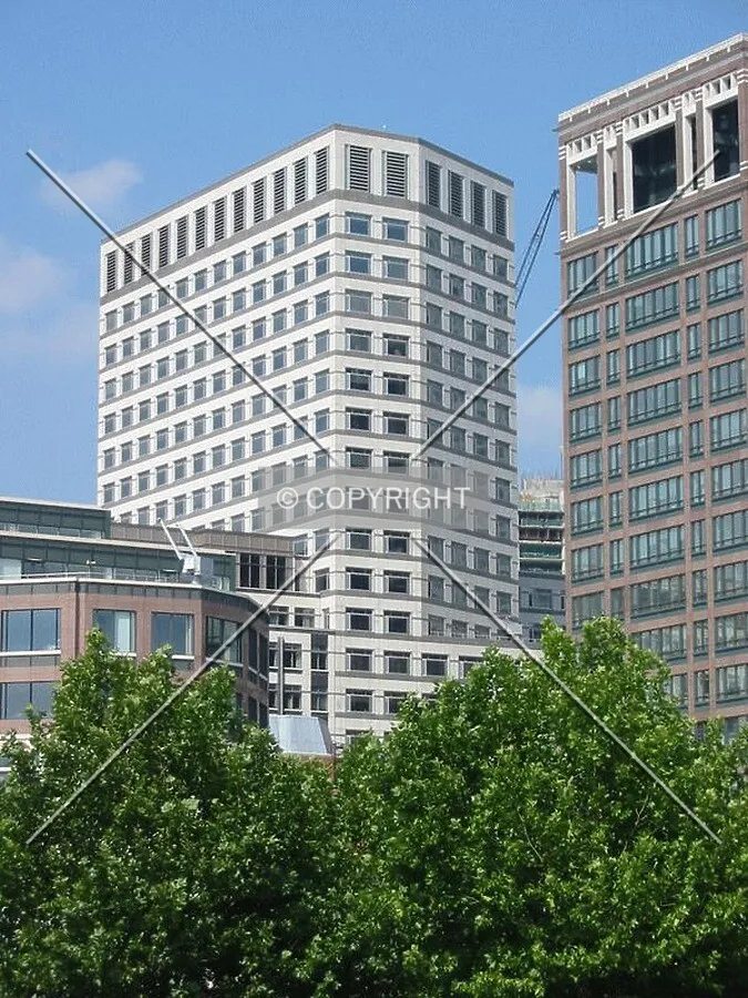 The white marble of One Cabot Square stands out against the rich browns of neighbouring buildings