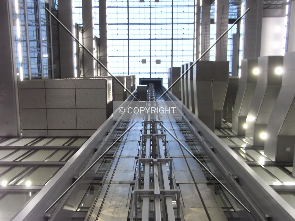 Inside Deutsche Börse Cube building - Looking up the elevator rail