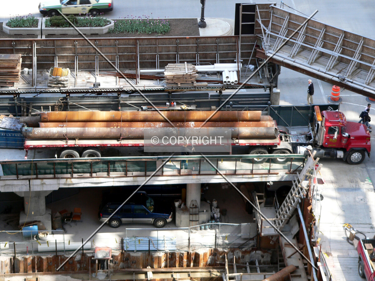 Used raker beams being trucked away