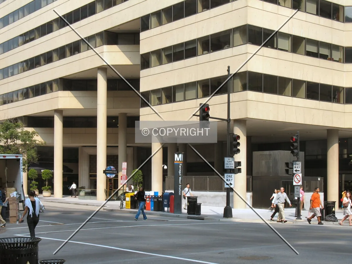 Base of the southeast corner, with the 18th Street entrance to the Farragut West Metro Station