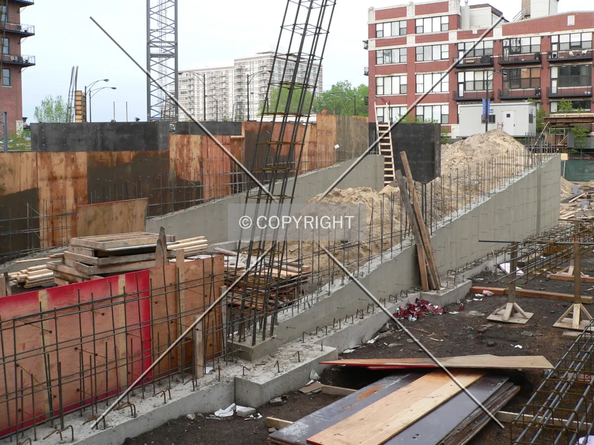 Looking northeast across the site with the beginnings of the parking ramp in the foreground